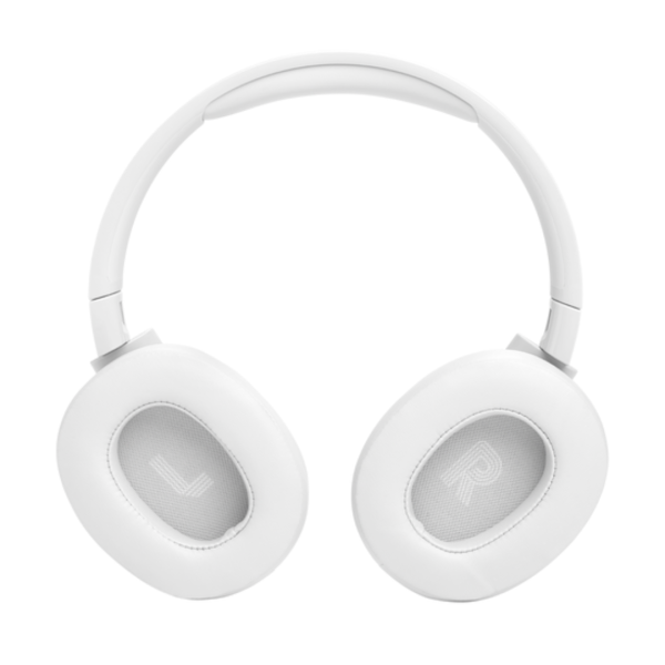 JBL Tune 770NC headphones blocking out noise in a busy outdoor environment.