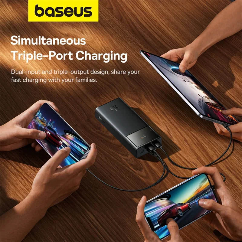 Baseus Star-Lord 30000mAh 30W power bank charging three devices simultaneously via USB-C and USB-A ports.